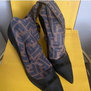 Fendi boots, very fancy, very demure. So comfortable. Worn 2xs… no damages